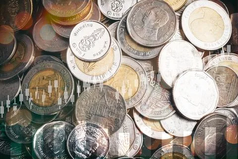 Double exposure of graph, stock display and money coins arranged as a graph.. Stock Photos