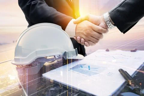 Double exposure of handshake, working solar station photovoltaic panels. Stock Photos