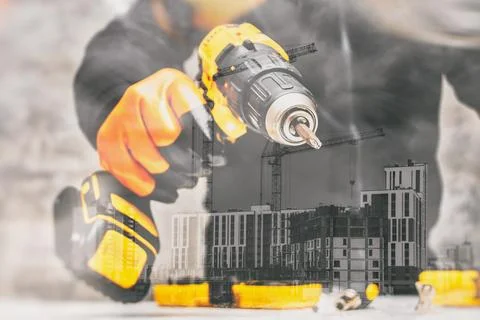 Double exposure image with drill with a construction site featuring cranes .. 스톡 사진
