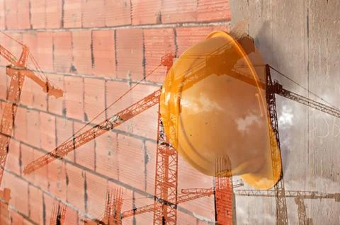 Double exposure image of tower cranes and working construction site 스톡 사진