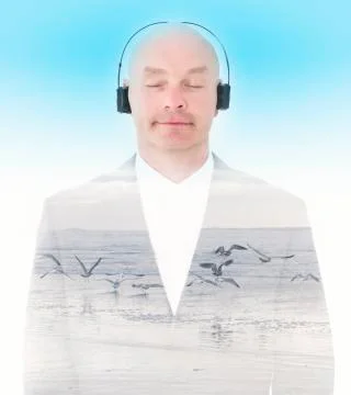 Double exposure of man with headphones and beach Stock Photos