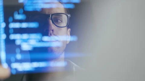 Double Exposure Shot of Man Hacker Programmer in Eyeglasses working at a laptop Video stock 113580838