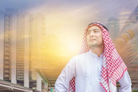 Double exposure of Smiling Arab Middle Eastern Businessman using smartphone 库存照片