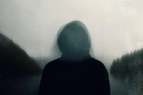 A double exposure of a spooky hooded figure over layered on a landscape Stock Photos