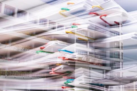 Double exposure stack overload document report paper and building office Fotos de archivo