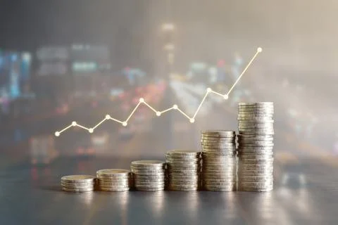 Double exposure stack of Thailand coins on black wooden table with profit chart Stock Photos