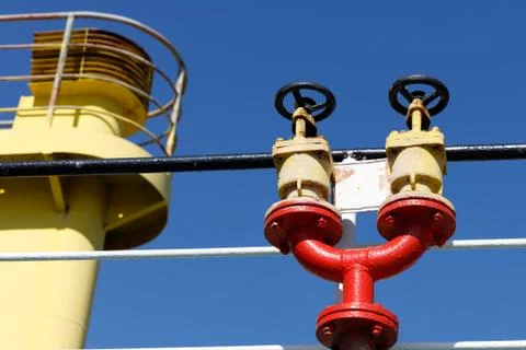 Double fire hydrant on the upper deck of a cargo ship Stock Photos