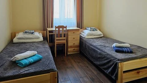 Double guest room with two single beds for a short overnight stay on a trip.. Stock Photos