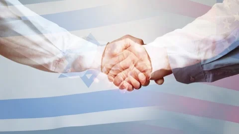 A double handshake against the background of the flags of the United States and Stock Footage 261442082