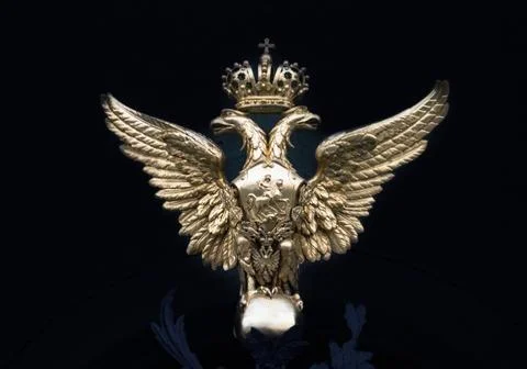 Double-headed eagle on a black background Stock Photos