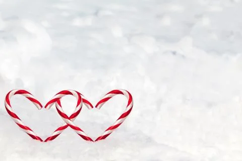 Double Heart Shape Candy Canes in the Snow Stock Photos