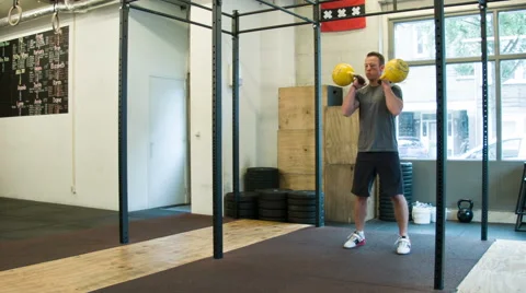 Double Kettlebell Push Press Weightlifting Movement at a CrossFit Box Stock-Footage 40033543