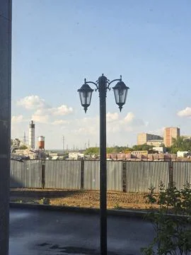 Double lantern street light post under blue sky Stock Photos