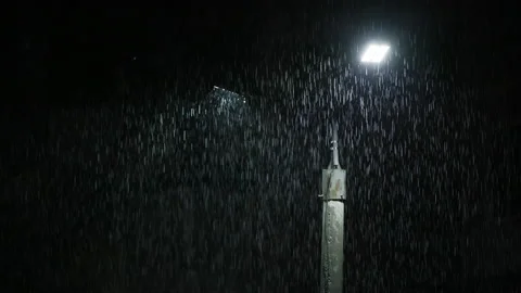 Double led panel lamppost under heavy rain at night. Midsize view of raindrops Video stock 209150758