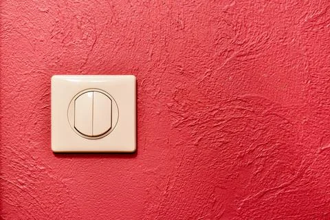 Double light switch against red wall closeup Stock Photos