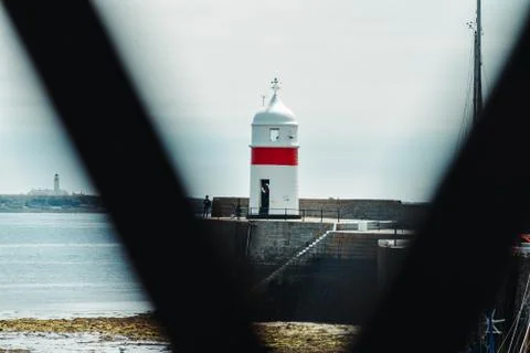 Double Lighthouse Through Bridge Railings 스톡 사진