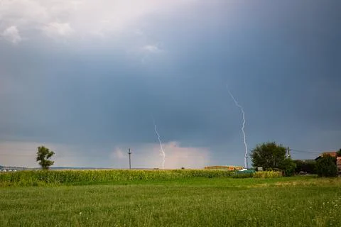 Double lightning strike from a daytime thunderstorm. Stock Photos