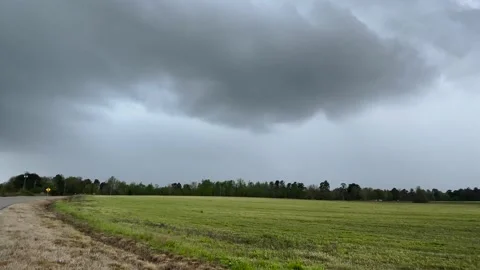 Double Lightning strike in the distance and country road during a storm in th Stock Footage 176077904