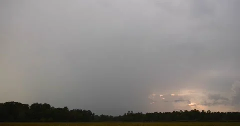 Double lightning strike next to diffuse sunset Stock Footage 137424238