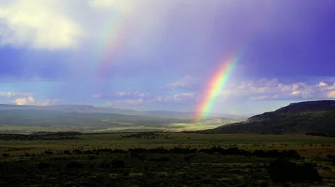 Double rainbow after storm in desert - Abiquiu, New Mexico Stock Footage 44212418