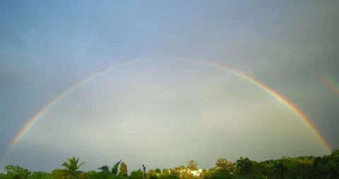 Double rainbow and clouds on sky at sunset. Dominican Republic. Stock Footage 276926966