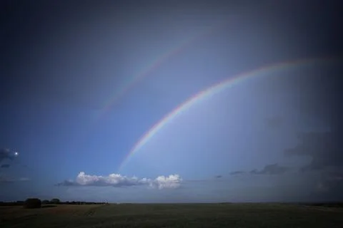 Double Rainbow Arching Over Open Fields Stock Photos