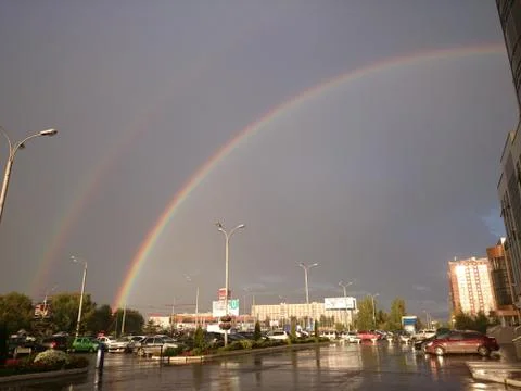 Double rainbow in the city Stock Photos