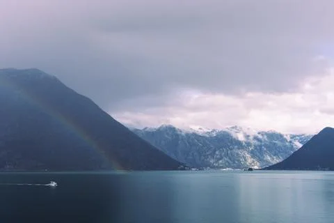 Double rainbow with dramatic clouds across the fjords of Kotor Bay Stock Photos