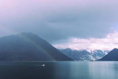 Double rainbow with dramatic clouds across the fjords of Kotor Bay Stock Photos