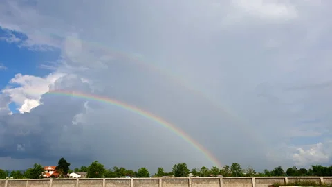 Double rainbow over rural area landscape when raining beautiful nature Video stock 194009108