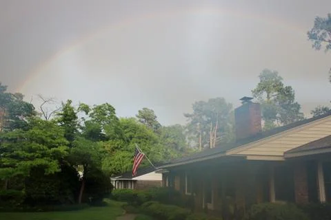 Double rainbow over tree line in Augusta, Georgia Stock Photos