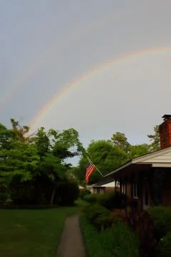 Double rainbow over tree line in Augusta, Georgia Stock Photos