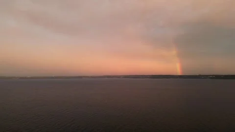 Double rainbow over the water with pink clouds Vídeos de archivo 294707938