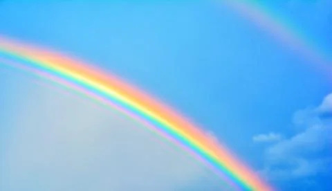 Double rainbow in sky with clouds Foto stock