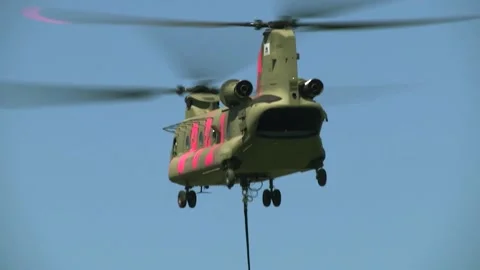 Double Rotor Helicopter Taking off and Carrying a Bucket Stock Footage 130588156