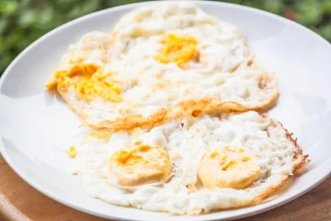 Double serving of star eggs on white plate Stock Photos