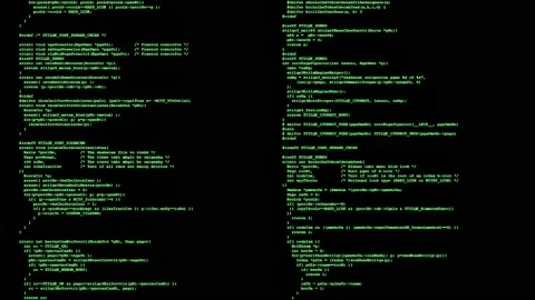 A double set of source code instructions (scrambled text) scrolling on a Stock Footage 201298229