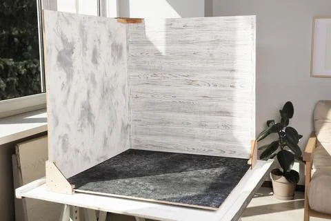 Double-sided backdrops on table in photo studio 스톡 사진