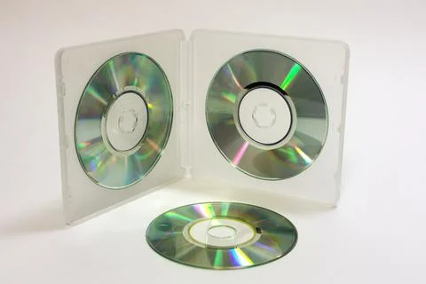 Double-sided transflective white case for storing mini discs with blank cds.. Stock Photos