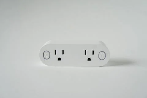 This double smart WIFI plug outlet can switch an electric device on or off vi Stock Photos
