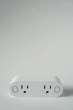 This double smart WIFI plug outlet can switch an electric device on or off vi Stock-Fotos