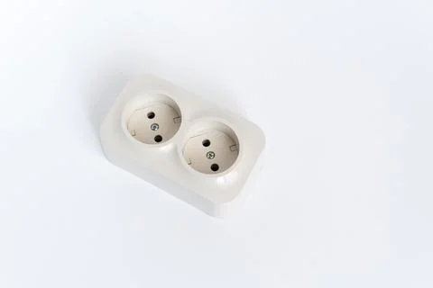 Double socket on a white background. two sockets, united by one monolithic case. Stock Photos