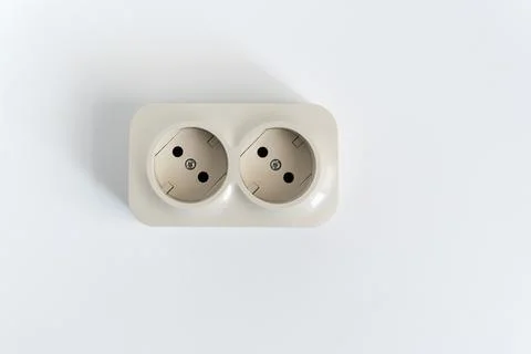 Double socket on a white background. two sockets, united by one monolithic case. Stock Photos