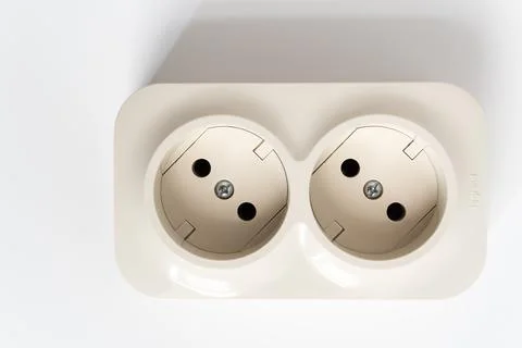 Double socket on a white background. two sockets, united by one monolithic case. Stock Photos