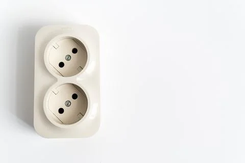 Double socket on a white background. two sockets, united by one monolithic case. Stock Photos