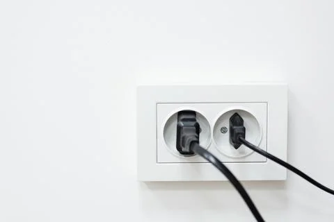 Double sockets with connected devices Stock Photos