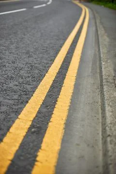 Double solid line of road markings in yellow. Perfectly clean border Stock Photos