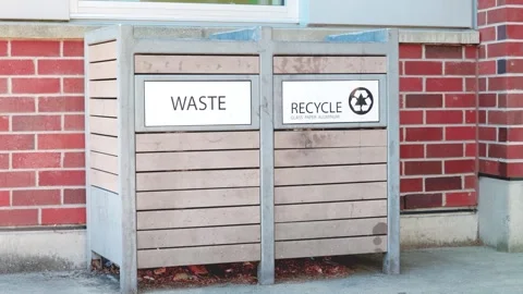 Double sorting waste and recycle bin on brick wall background Stock Footage 336299700