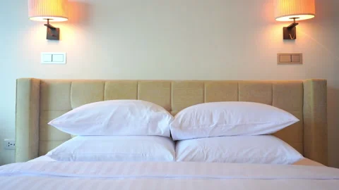 Double stack comfy pillows in a luxury hotel Stock Footage 142735608