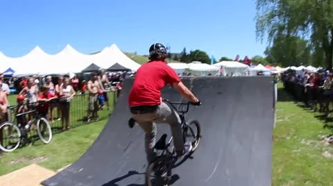 Double tailwhip over a bmx jump Stock Footage 8960090